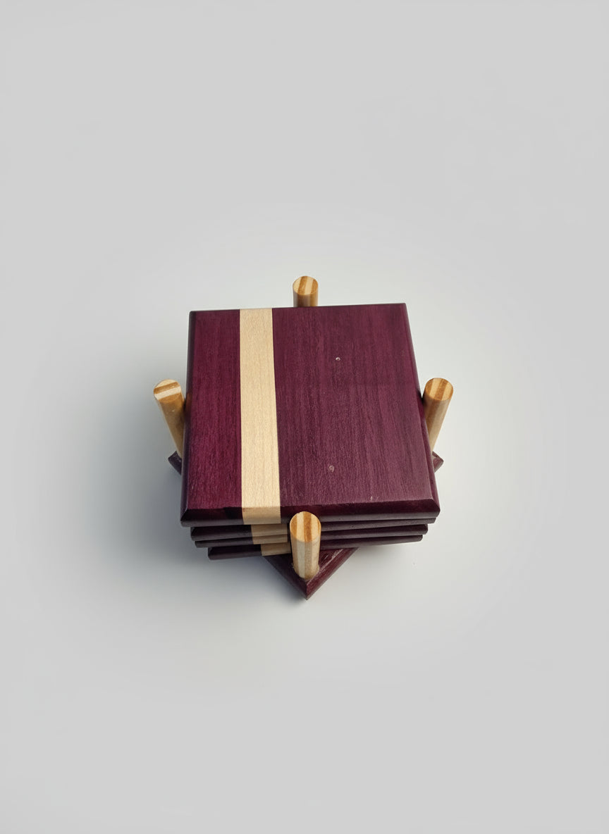 Stack of wooden coasters made from purpleheart wood with a maple strip