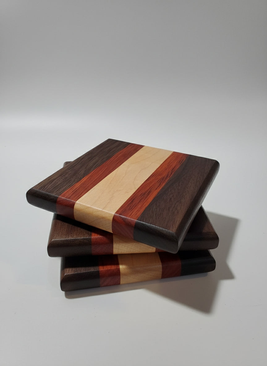 Stack of wooden coasters with different wood walnut/paduk/maple